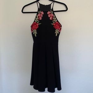 Black cocktail dress with embroidery